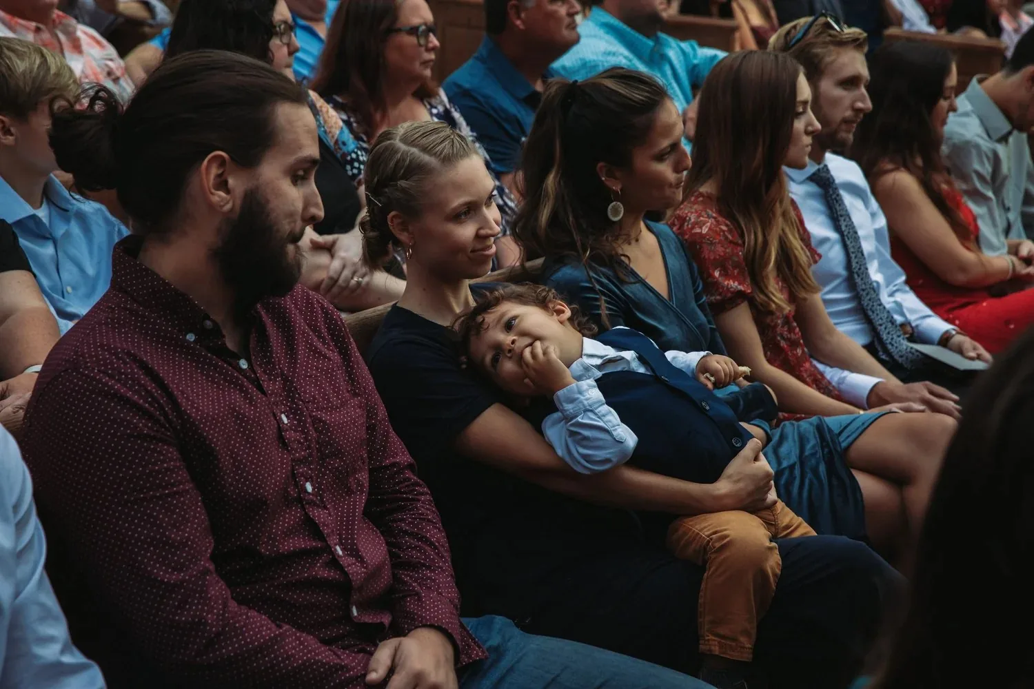 Family watching a wedding ceremony