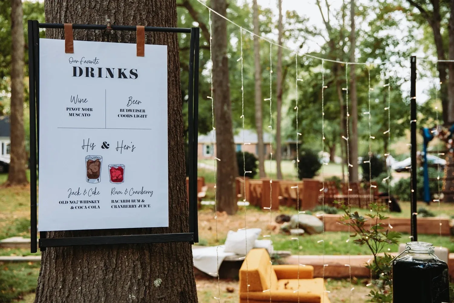 Outdoor wedding cocktail setting among tall trees