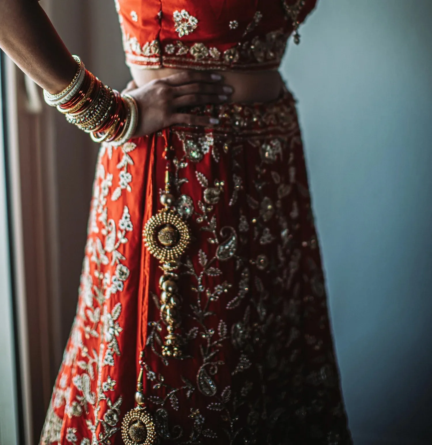 Detail of red and gold wedding attire